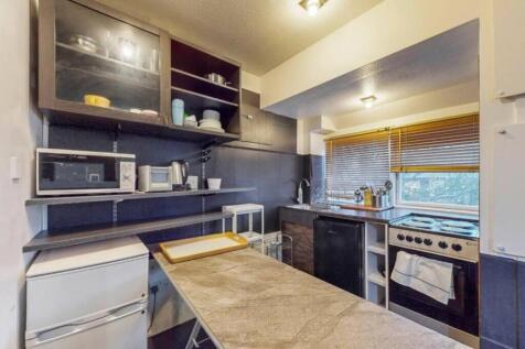 A functional kitchen with ample storage and nat...