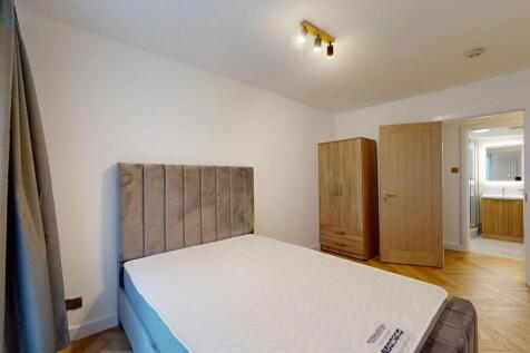 Bright and modern double bedroom featuring a pl...