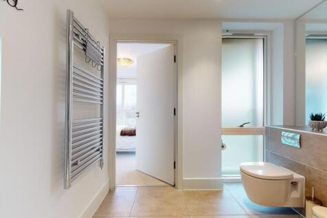 A modern and well-maintained bathroom featuring...