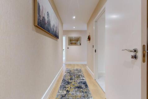 A clean and well-maintained hallway featuring m...