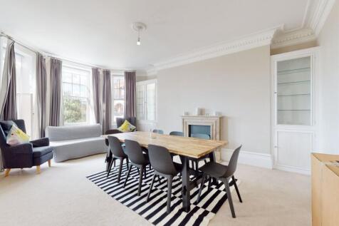 A bright and airy living room featuring a large...