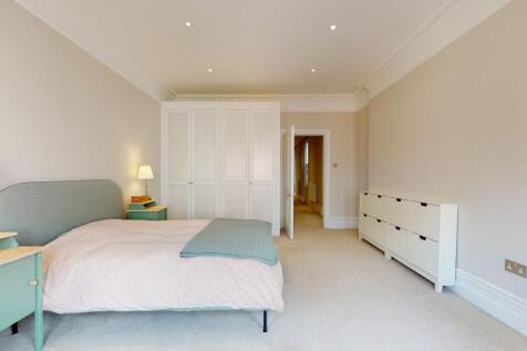 Spacious and serene master bedroom featuring a ...