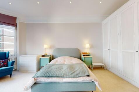 Bright and airy double bedroom featuring a comf...