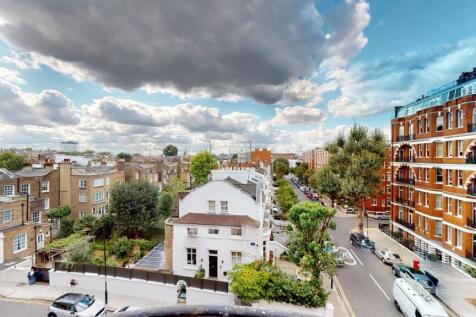 A charming street view featuring classic terrac...
