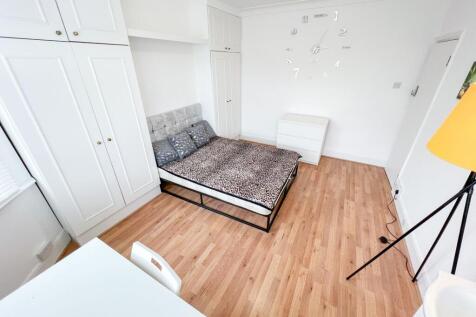 Bright and spacious master bedroom featuring a ...