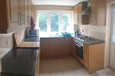 Bright and well-maintained kitchen featuring am...