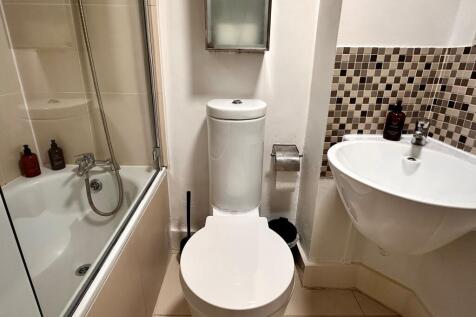 Bright and clean bathroom featuring a modern wh...