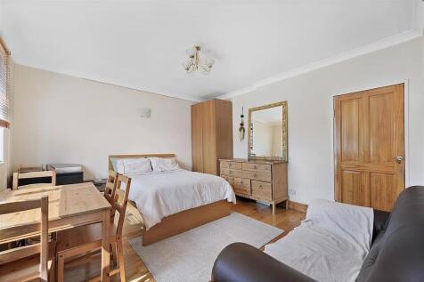 Bright and inviting master bedroom featuring a ...