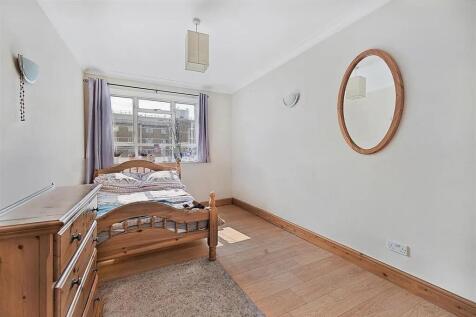 A bright and inviting double bedroom featuring ...