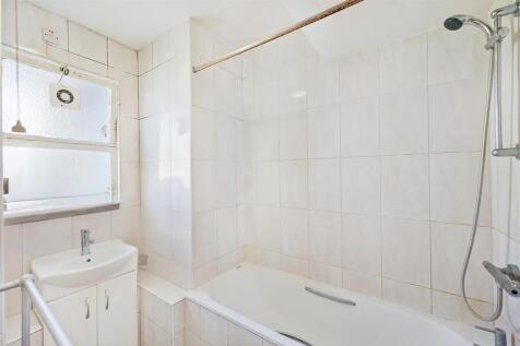 Bright and clean bathroom featuring a modern wh...