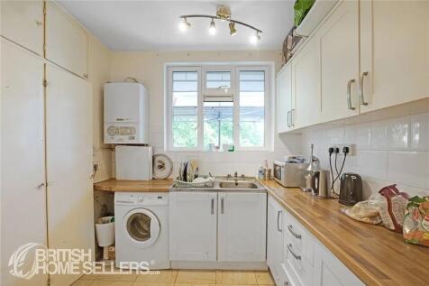 Bright and tidy kitchen with ample counter spac...