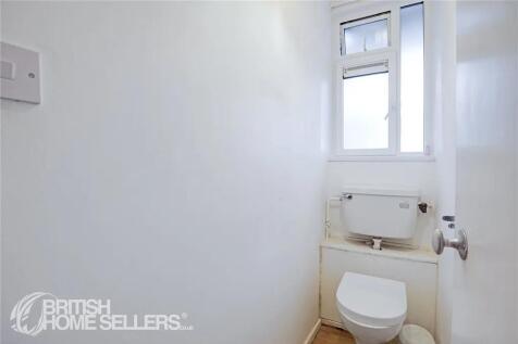 Compact and functional single toilet room featu...