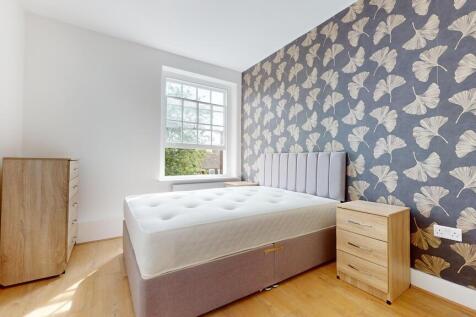 Bright and stylish double bedroom featuring a c...