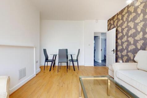 A bright and modern living room featuring clean...