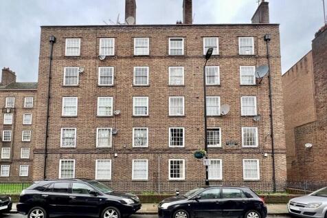 A classic brick terraced residential building w...