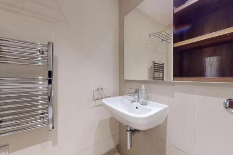 A modern, well-maintained bathroom featuring a ...