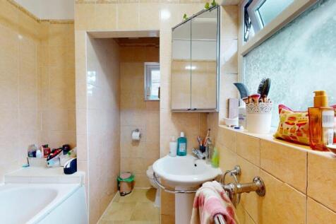 Bright and well-maintained bathroom featuring a...