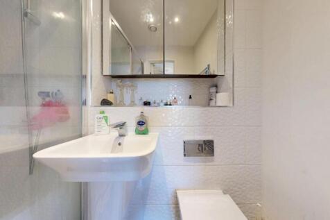 Bright and well-maintained bathroom featuring a...
