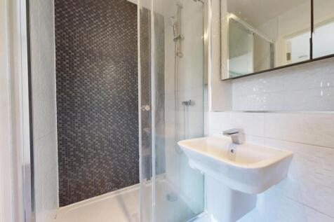 Bright and modern bathroom featuring a spacious...