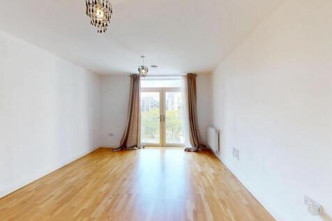 Bright and airy living room featuring polished ...