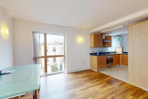 Bright and airy living area with large windows ...