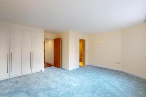 Bright and spacious living room featuring a lar...