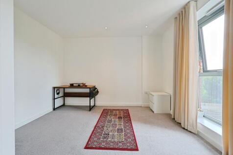 Bright, spacious living room featuring a large ...