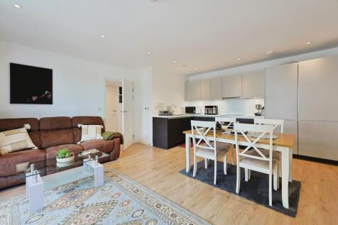 Modern and spacious living area featuring a com...