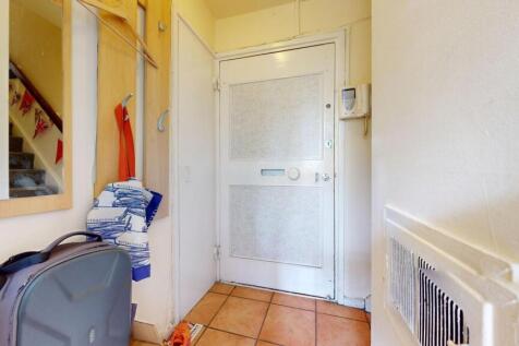 A tidy and practical entrance hallway featuring...