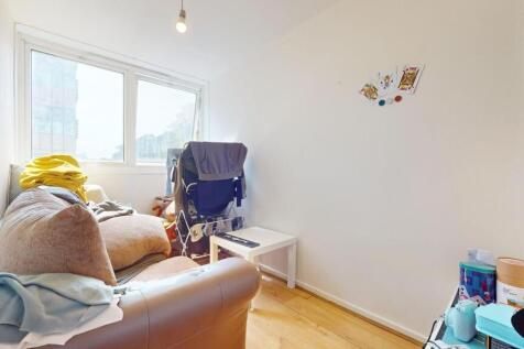 A cozy communal lounge featuring a comfortable ...