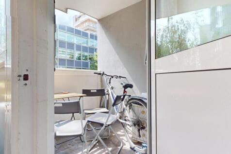 A bright and inviting outdoor balcony area with...