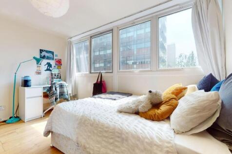Bright and cozy single bedroom with a large win...