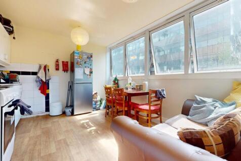 Bright and inviting kitchen space with large wi...