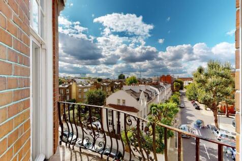A charming view from a balcony overlooking a pe...
