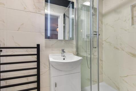Modern bathroom featuring a sleek sink with a m...