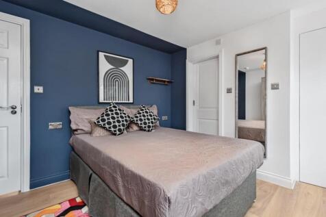 A stylish and inviting double bedroom featuring...
