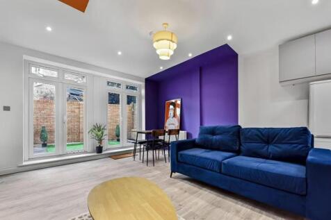 A contemporary living room with a large blue so...