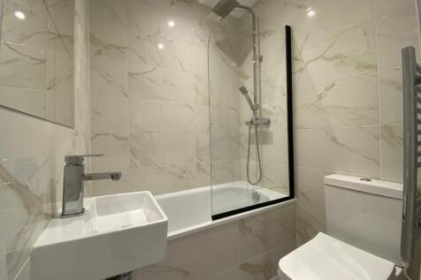 A modern, well-maintained bathroom featuring a ...