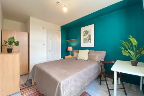 Bright and inviting double bedroom with stylish...