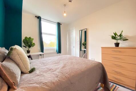 Bright and welcoming bedroom featuring a large ...