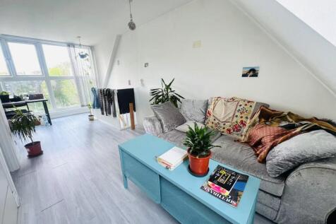 Bright and airy living room with large windows ...
