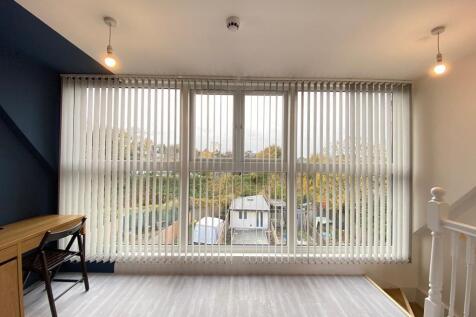 A bright and welcoming view of the front of a r...