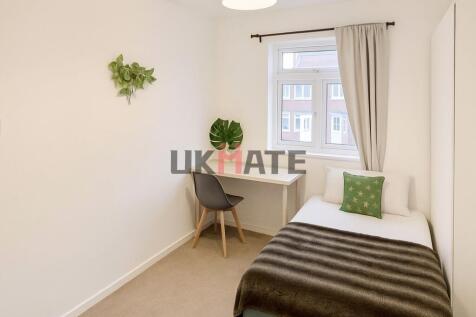 Bright and inviting master bedroom featuring a ...