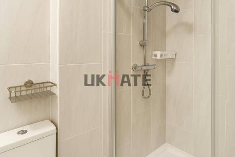 An clean and modern bathroom featuring a spacio...