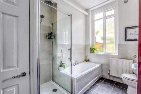 Bright and well-maintained bathroom featuring a...