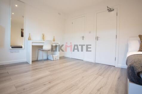 A bright, well-maintained bedroom featuring a s...