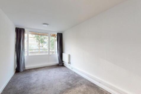 Bright and welcoming living room with large win...