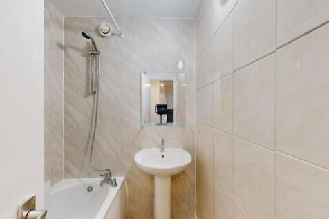 A clean and functional bathroom featuring a bat...