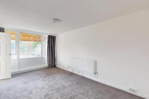 Bright and spacious living room with large wind...