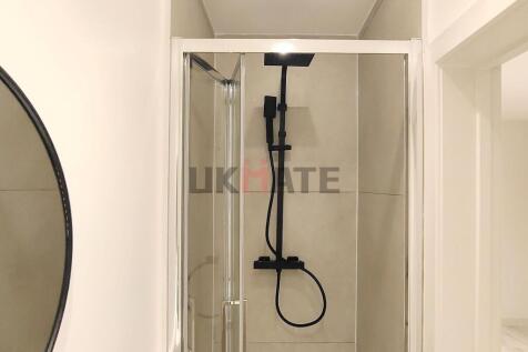 A clean and modern bathroom featuring a sleek s...